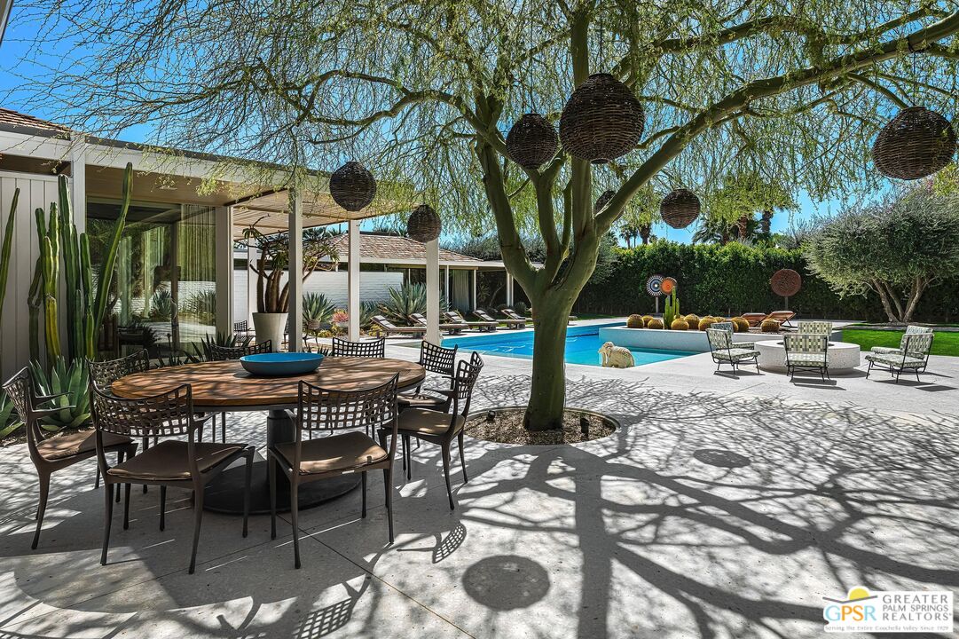 611 North Phillips Road Palm Springs, CA 92262 - Photo 7 of 10 a view of a patio with a table and chairs