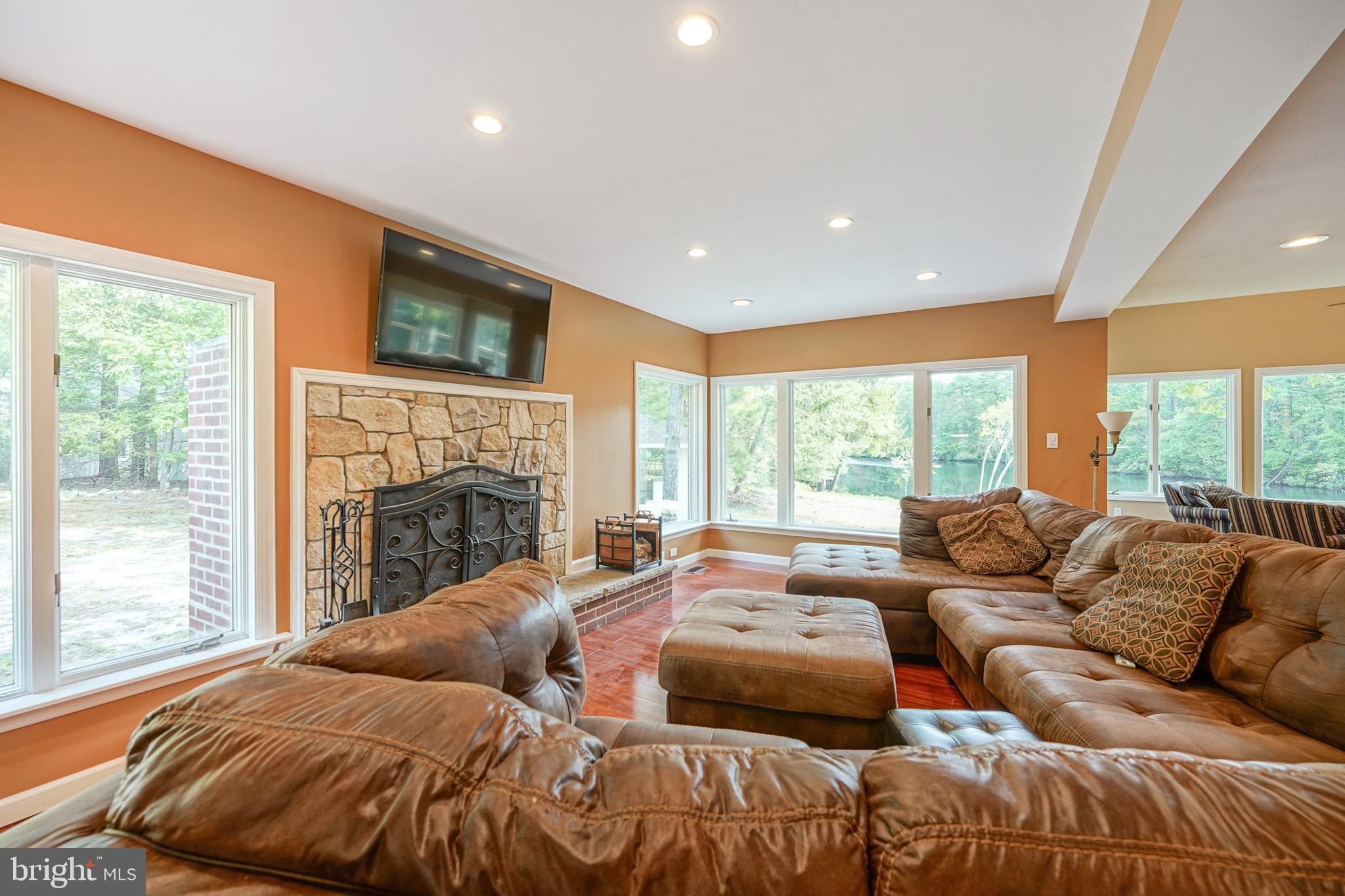 153 Hopewell Road Marlton, NJ 08053 - Photo 14 of 68 a living room with furniture a wooden floor and a large window