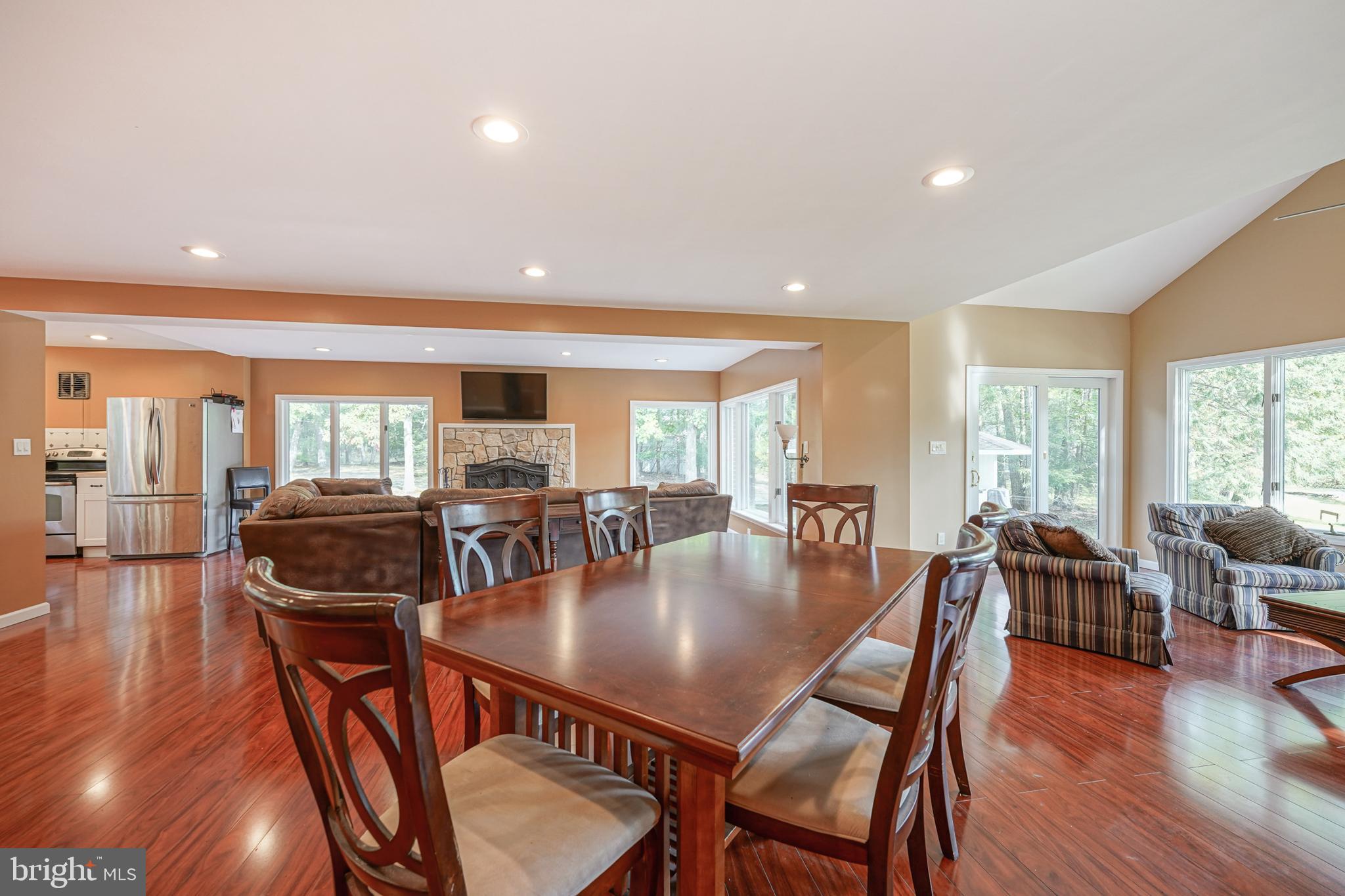 153 Hopewell Road Marlton, NJ 08053 - Photo 15 of 68 a living room with furniture a fireplace and a large window