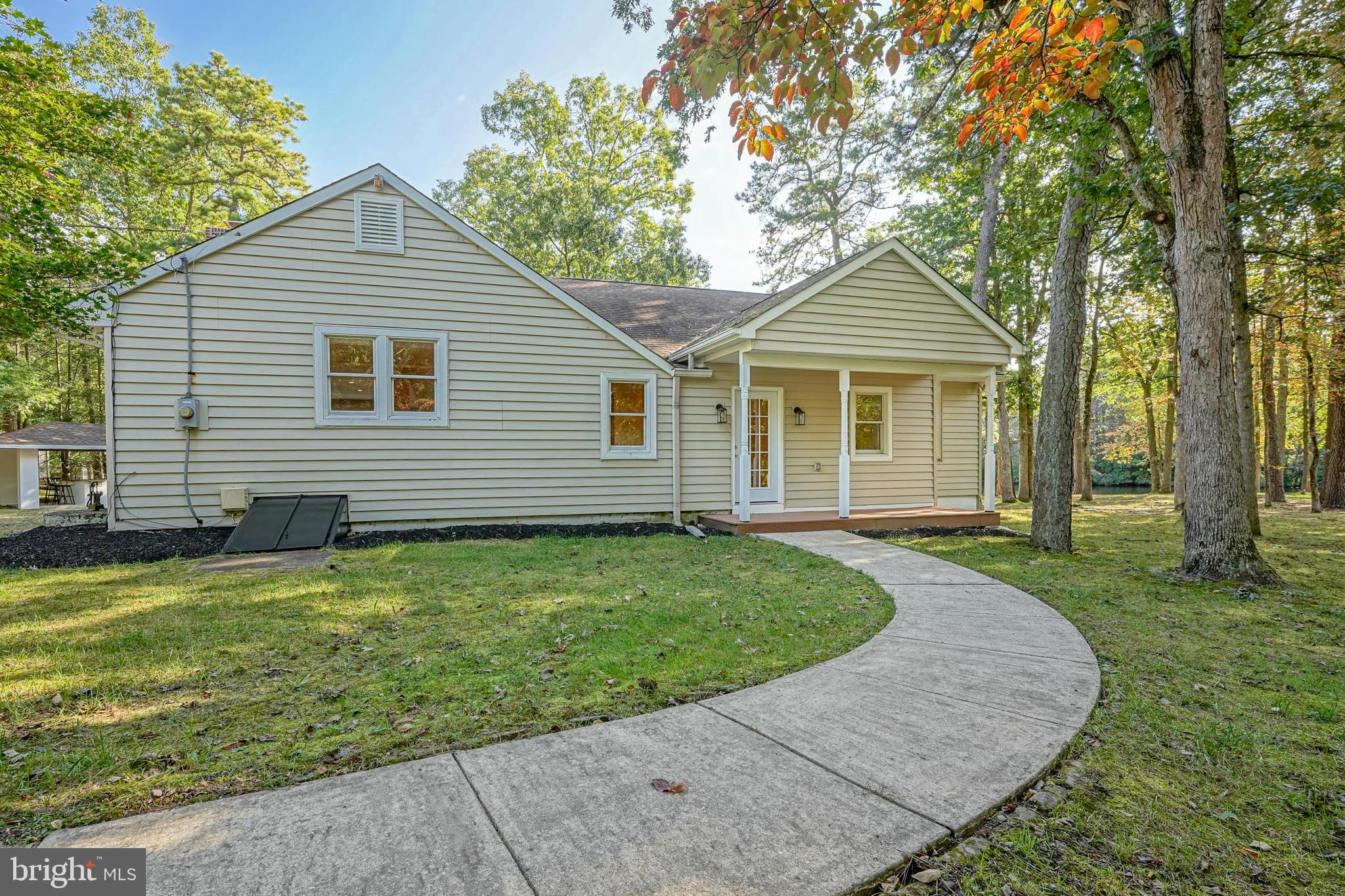 153 Hopewell Road Marlton, NJ 08053 - Photo 3 of 68 a front view of a house with a garden