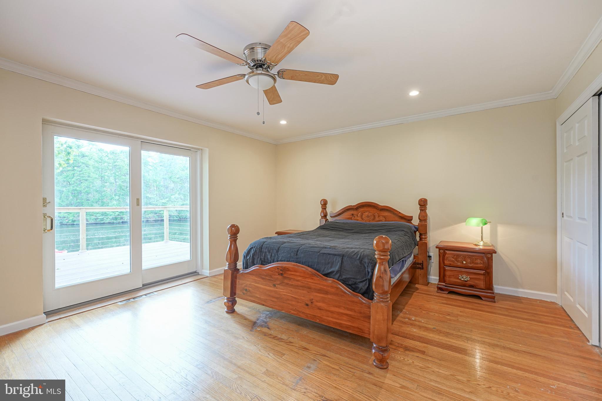 153 Hopewell Road Marlton, NJ 08053 - Photo 27 of 68 a bedroom with a bed and wooden floor