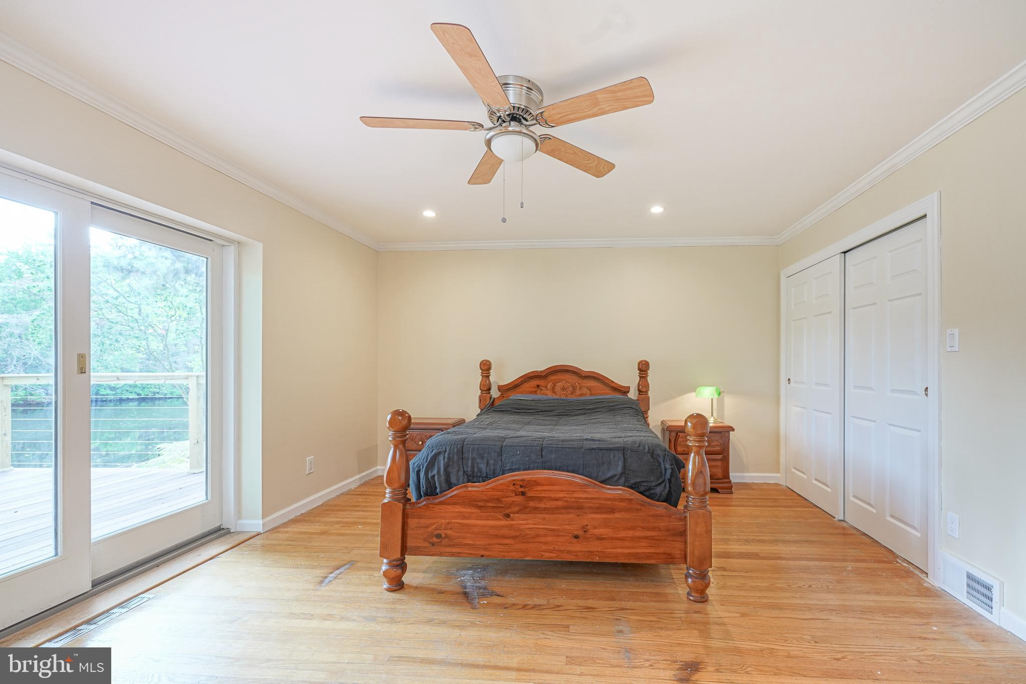 153 Hopewell Road Marlton, NJ 08053 - Photo 28 of 68 a bedroom with a bed and wooden floor