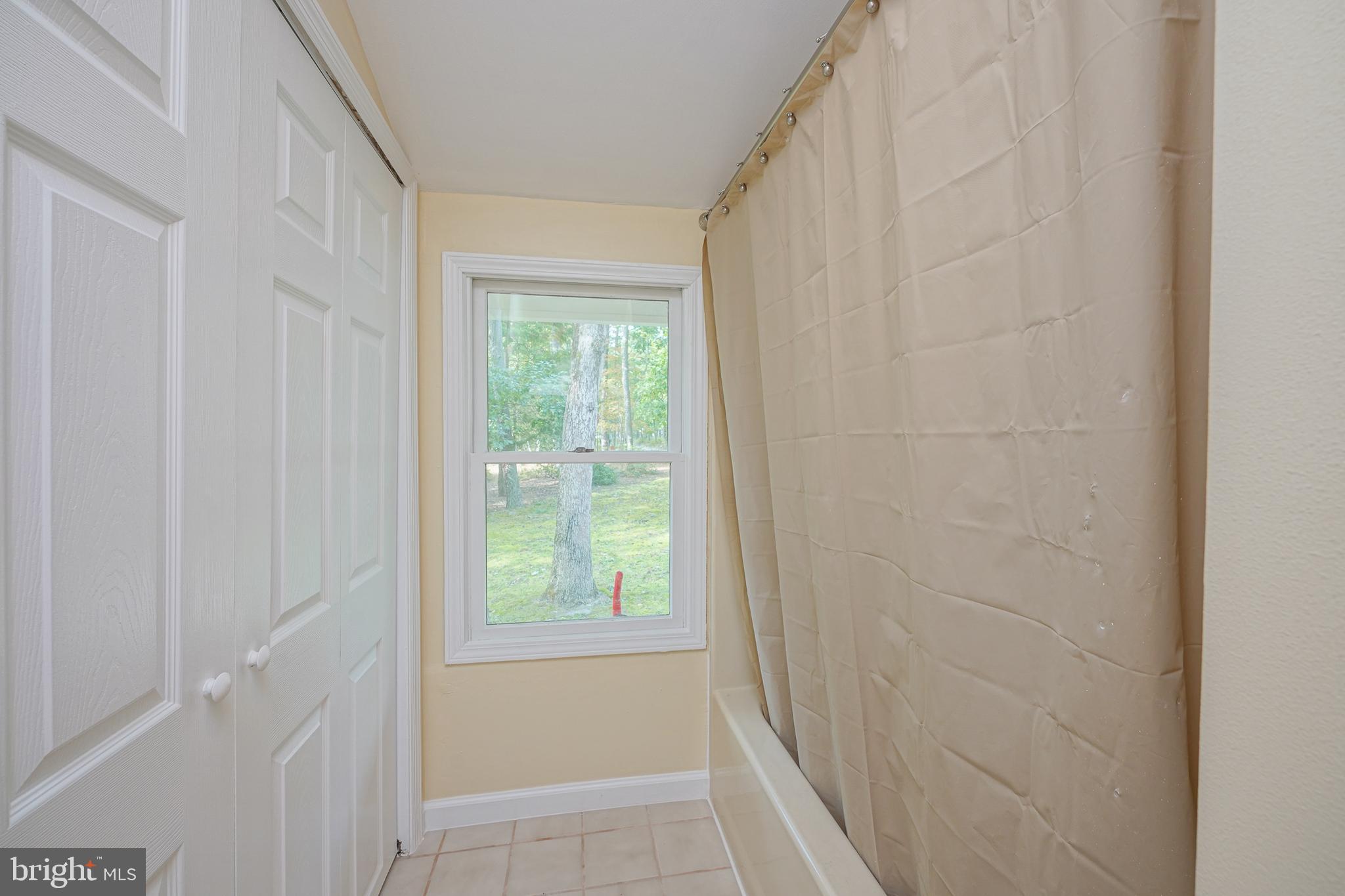 153 Hopewell Road Marlton, NJ 08053 - Photo 35 of 68 a workspace with wooden floor and a window