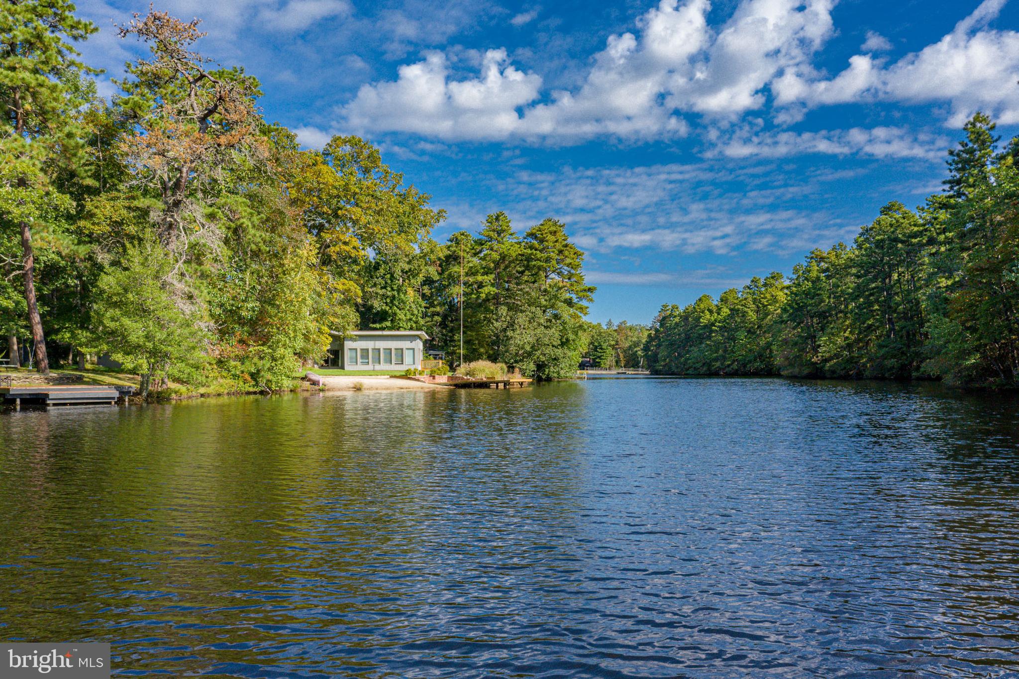 153 Hopewell Road Marlton, NJ 08053 - Photo 6 of 68 a view of an ocean with a house in the background