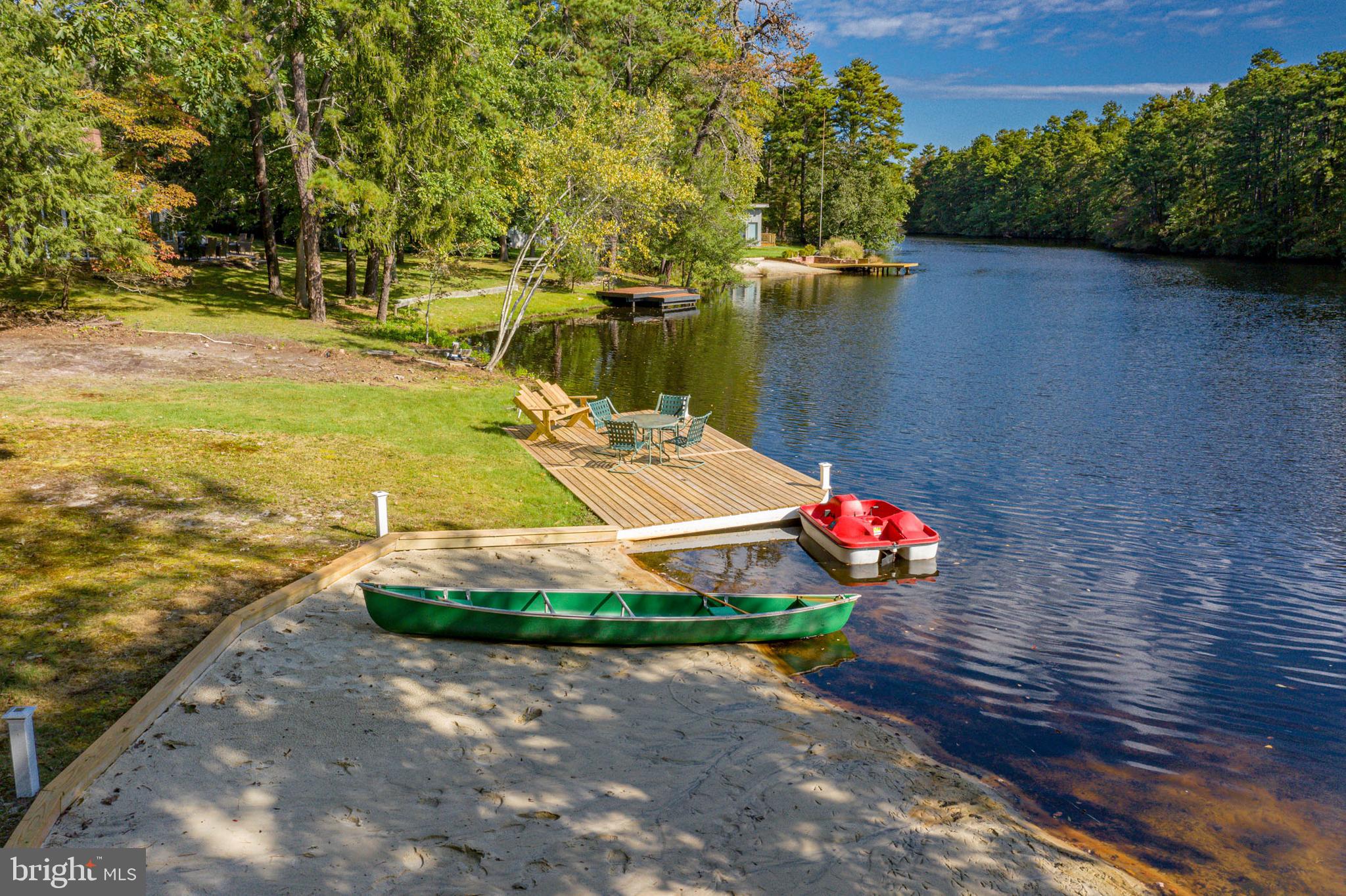153 Hopewell Road Marlton, NJ 08053 - Photo 7 of 68 a view of a lake with a yard