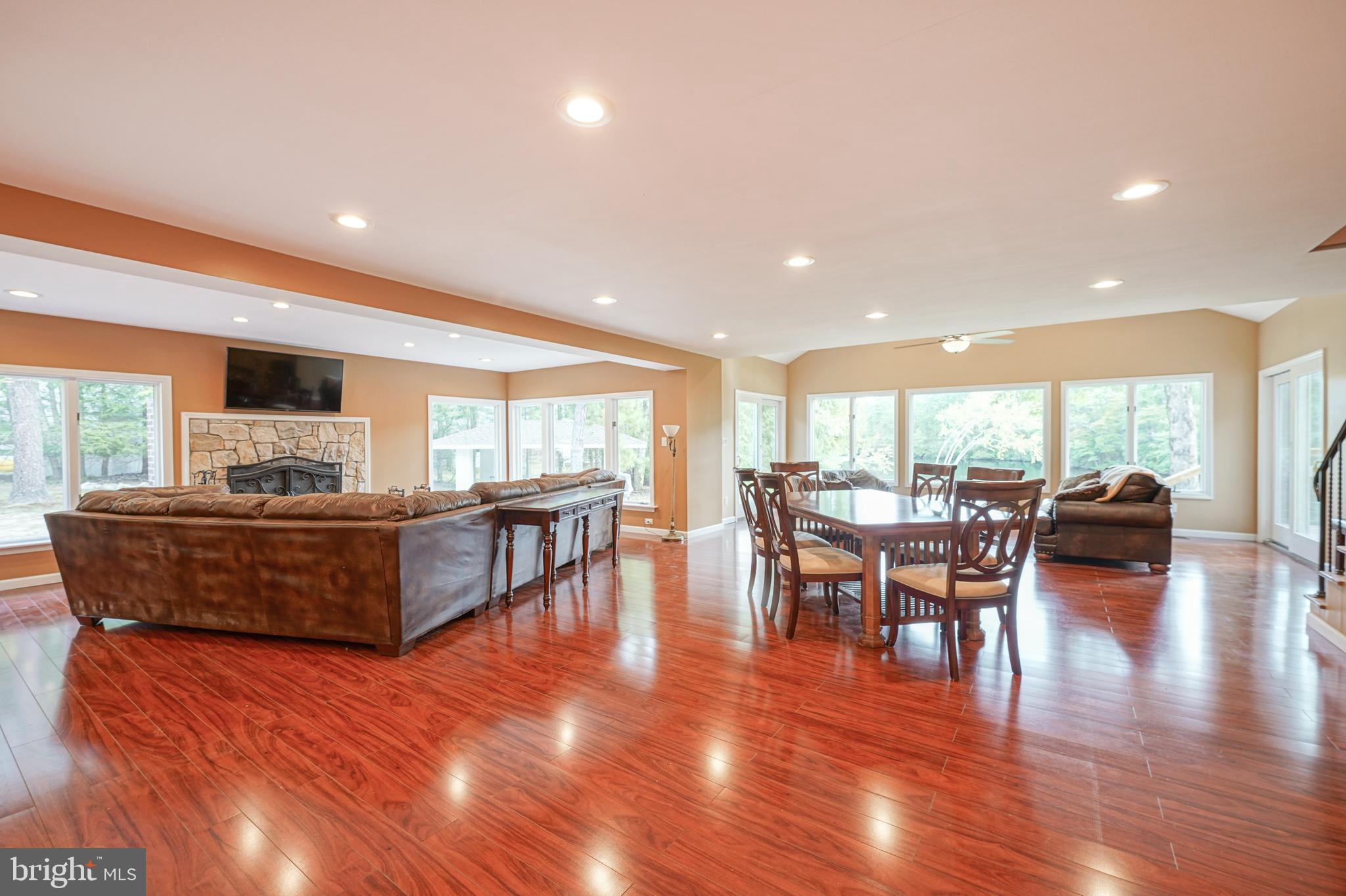 153 Hopewell Road Marlton, NJ 08053 - Photo 8 of 68 a living room with furniture a wooden floor and a large window