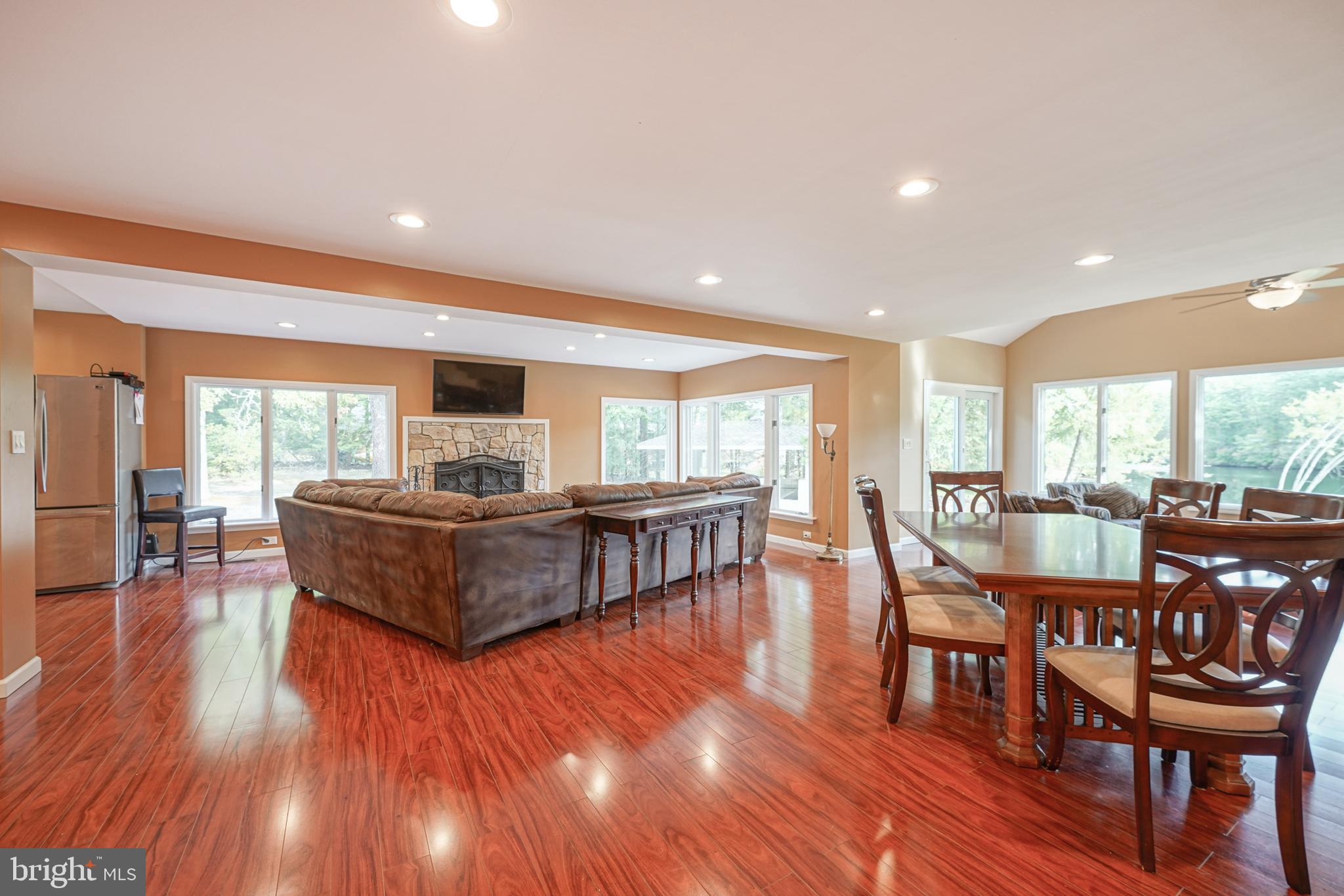 153 Hopewell Road Marlton, NJ 08053 - Photo 10 of 68 a living room with furniture flat screen tv and a fireplace