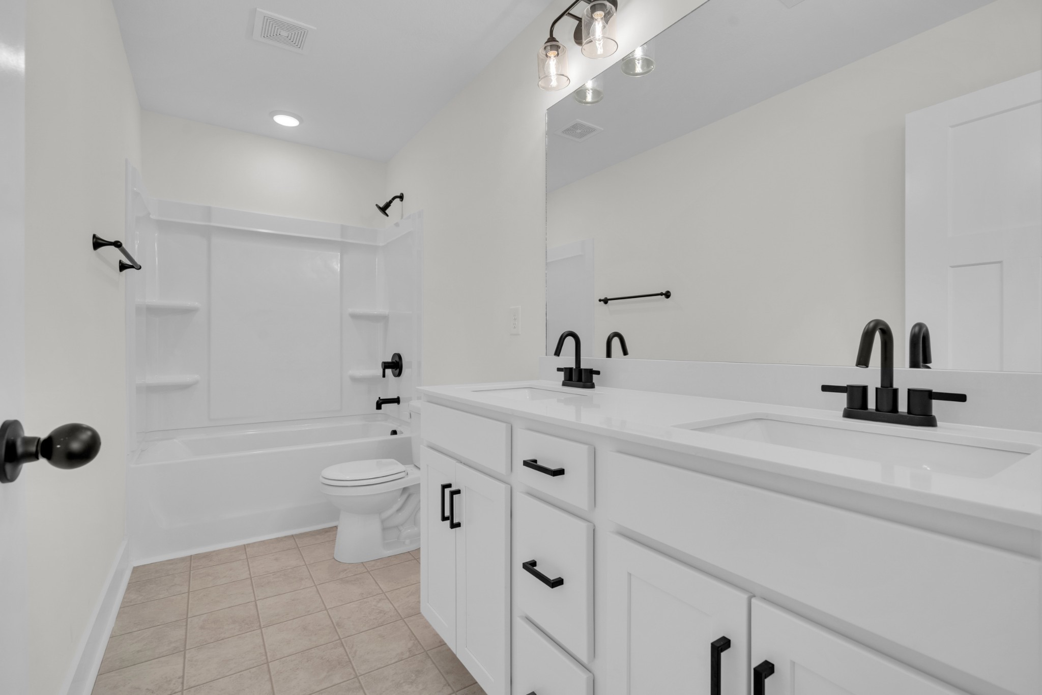 119 Front Rdg Circle Clarksville, TN 37042 - Photo 28 of 41 a bathroom with a double vanity sink a toilet a mirror and shower