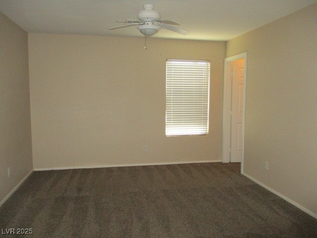 811 Wintersweet Road Henderson, NV 89015 - Photo 34 of 60 Unfurnished room with dark colored carpet and a ceiling fan