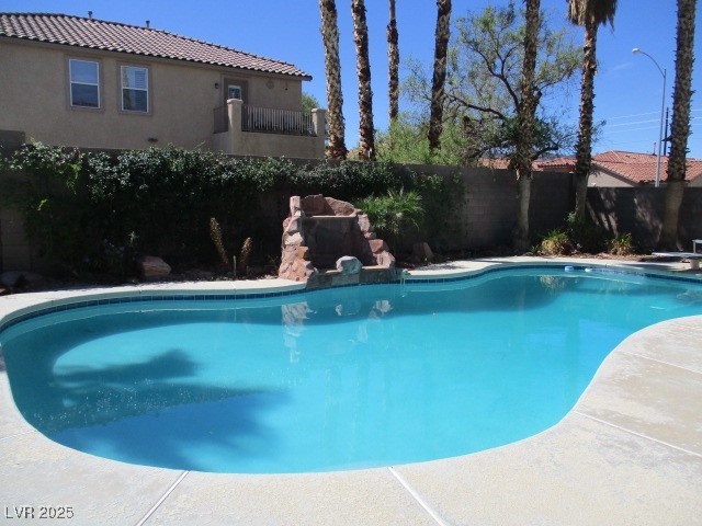 811 Wintersweet Road Henderson, NV 89015 - Photo 54 of 60 View of pool featuring a balcony, a fenced backyard, and a patio area