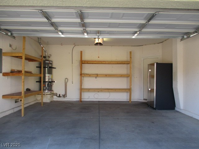 811 Wintersweet Road Henderson, NV 89015 - Photo 58 of 60 Garage featuring freestanding refrigerator, secured water heater, and a garage door opener