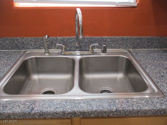 811 Wintersweet Road Henderson, NV 89015 - Photo 9 of 60 Kitchen view of dark countertops - sink