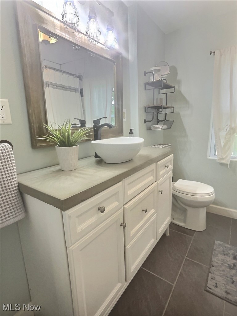 3688 Easton Road Norton, OH 44203 - Photo 34 of 37 Bathroom with toilet, vanity, and tile patterned flooring