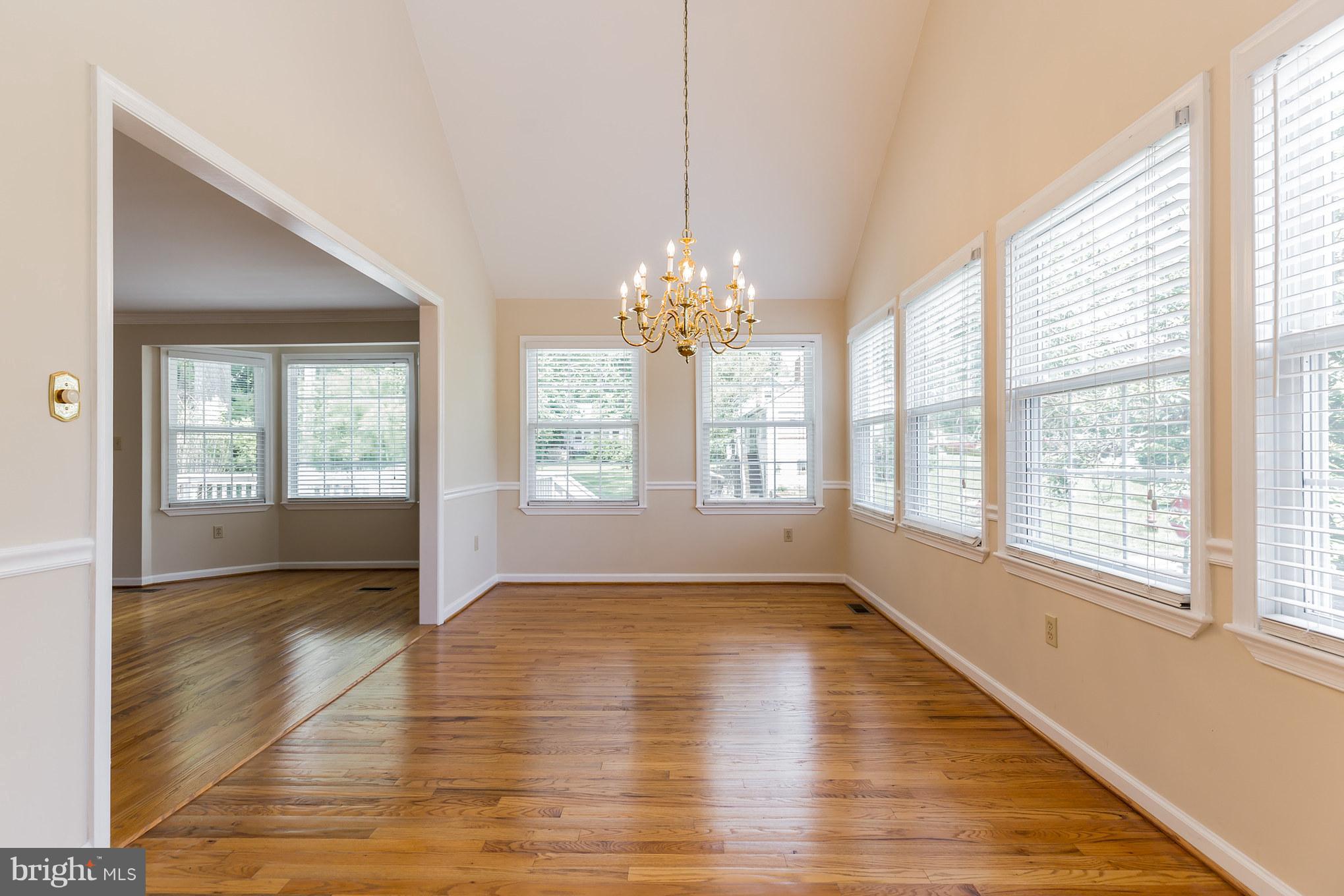 5875 Bayside Road St. Leonard, MD 20685 - Photo 6 of 29 Huge Dining Room, Chair Railing, HW Floors
