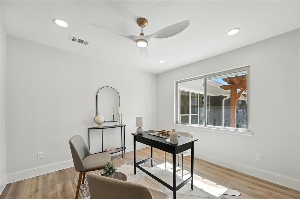 7620 La Risa Drive Dallas, TX 75248 - Photo 18 of 34 a view of a workspace with furniture and a window