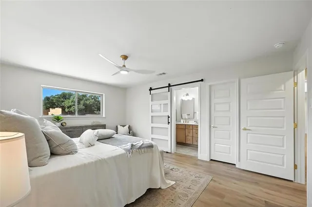 a living room with furniture and a open closet