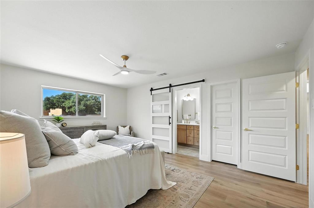 7620 La Risa Drive Dallas, TX 75248 - Photo 22 of 34 a living room with furniture and a open closet