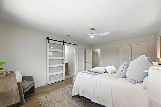 a bedroom with a bed and a television