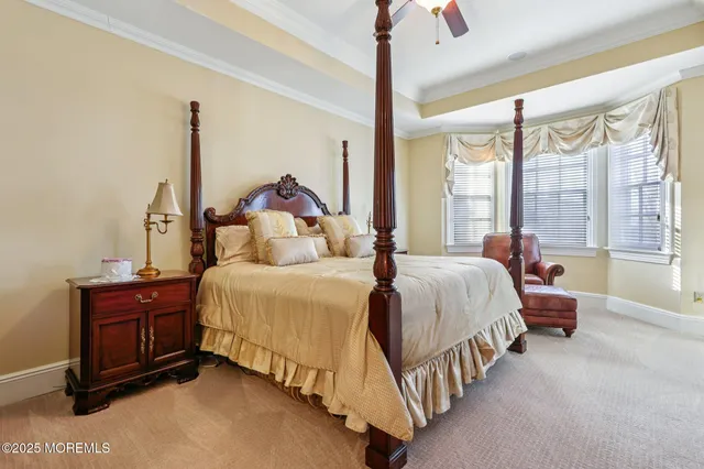 a bed room with a bed and a chandelier