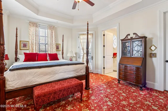 a bedroom with a bed dresser and a window