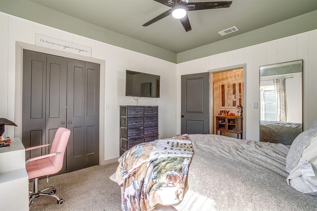 610 North Mesquite Hico, TX 76457 - Photo 21 of 34 a bedroom with a bed and a chair