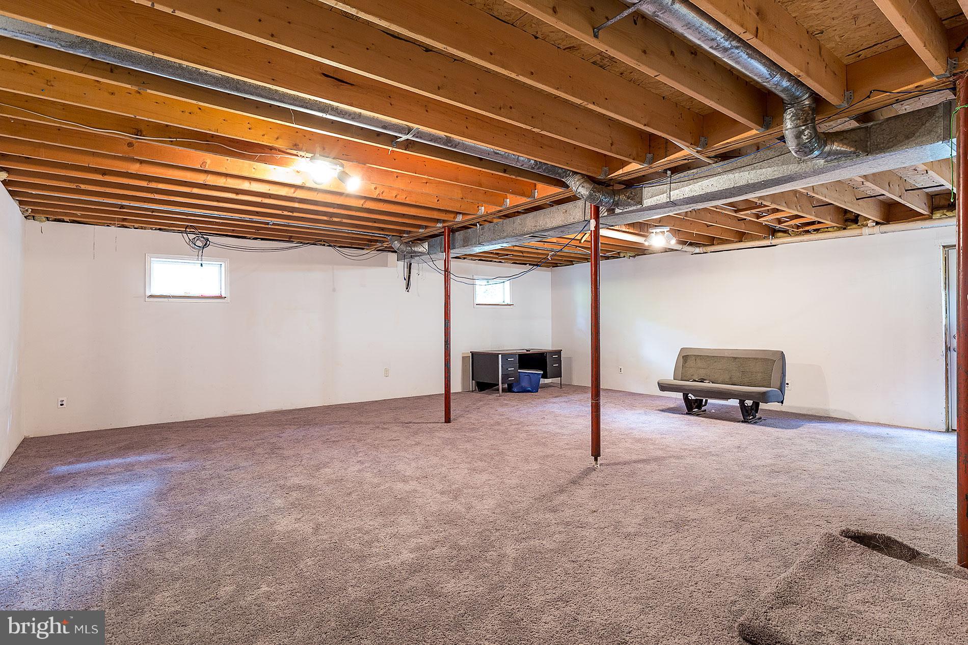 12104 Ward Road King George, VA 22485 - Photo 13 of 19 Carpeted Basement with Drywall Up!