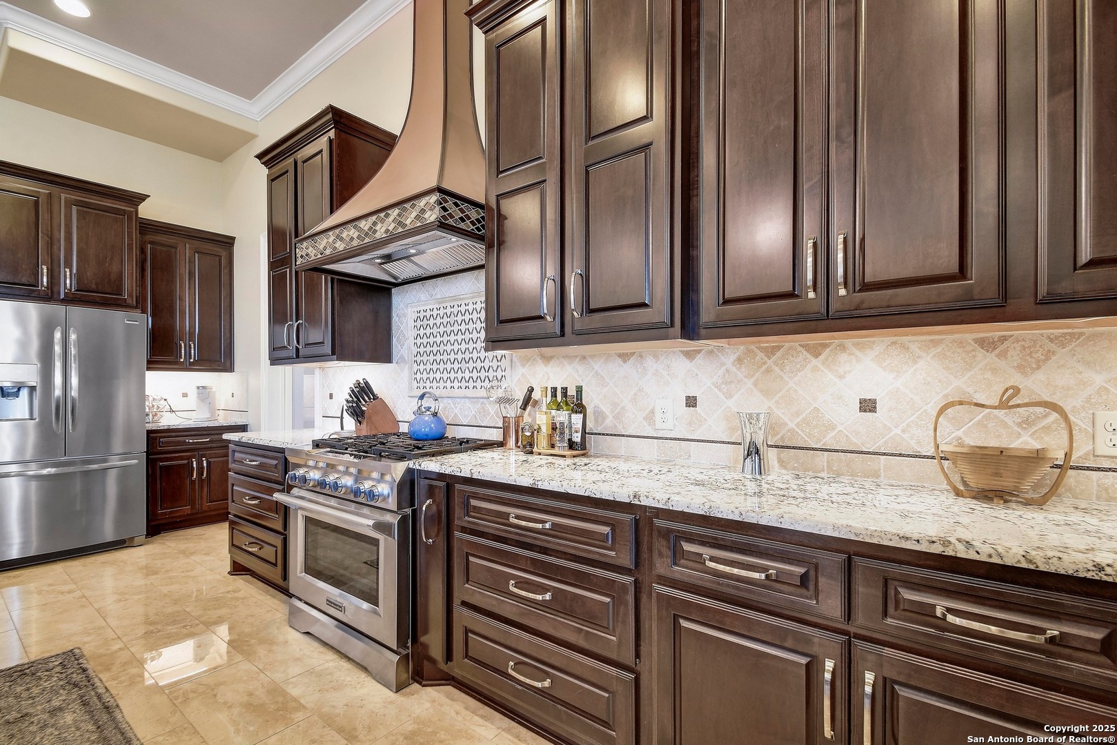 8 Braeburn Court Bulverde, TX 78163 - Photo 22 of 64 a kitchen with stainless steel appliances granite countertop a stove a sink and a refrigerator