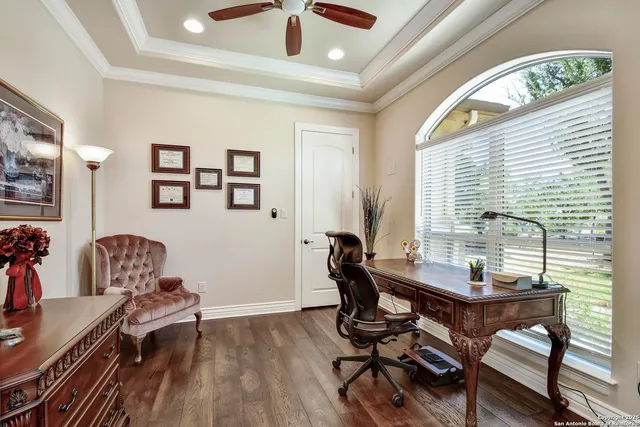 a kitchen with granite countertop white cabinets and a sink