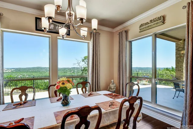 a spacious bathroom with a double vanity sink a mirror a bathtub and next to a window