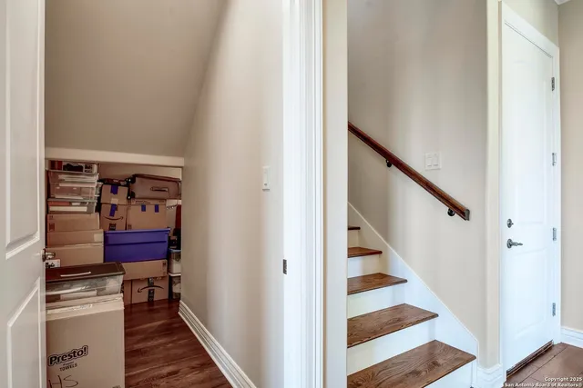 a bedroom with a bed a dresser and a window