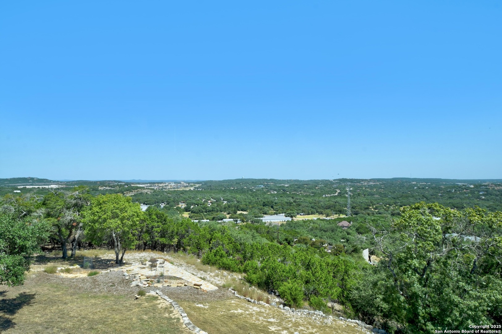 8 Braeburn Court Bulverde, TX 78163 - Photo 4 of 64 a view of a city with lush green forest