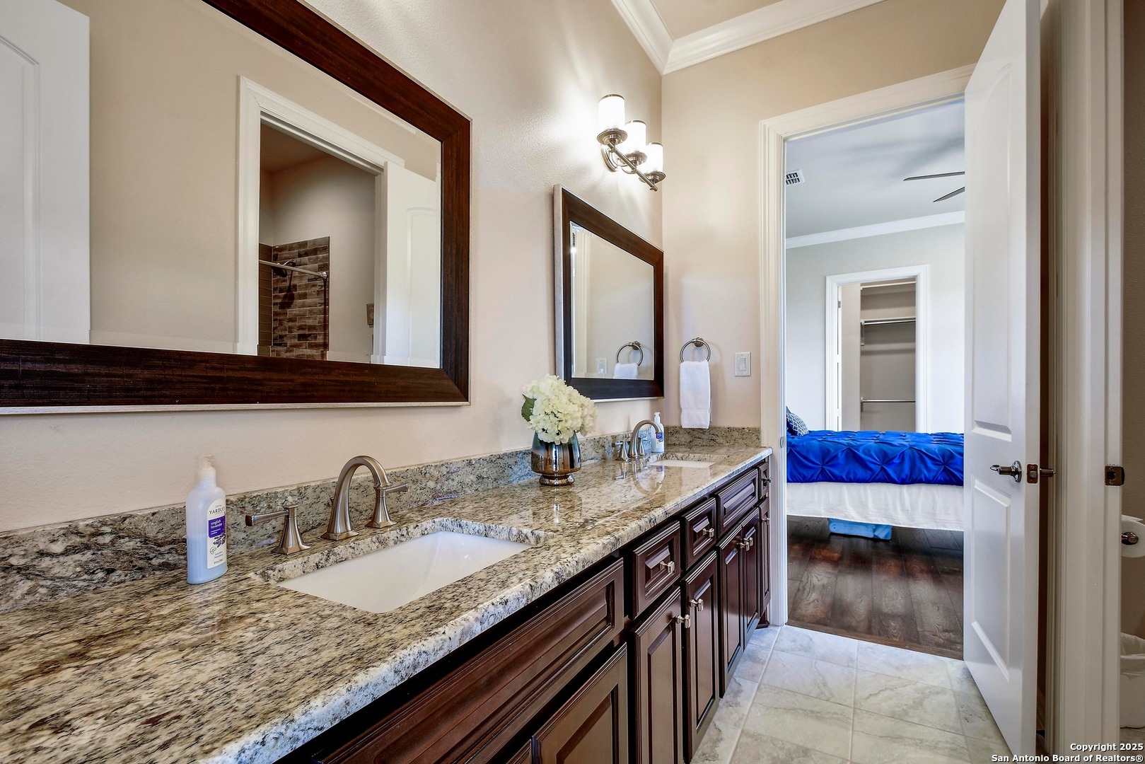 8 Braeburn Court Bulverde, TX 78163 - Photo 42 of 64 a en suite bathroom with a granite countertop sink and a mirror
