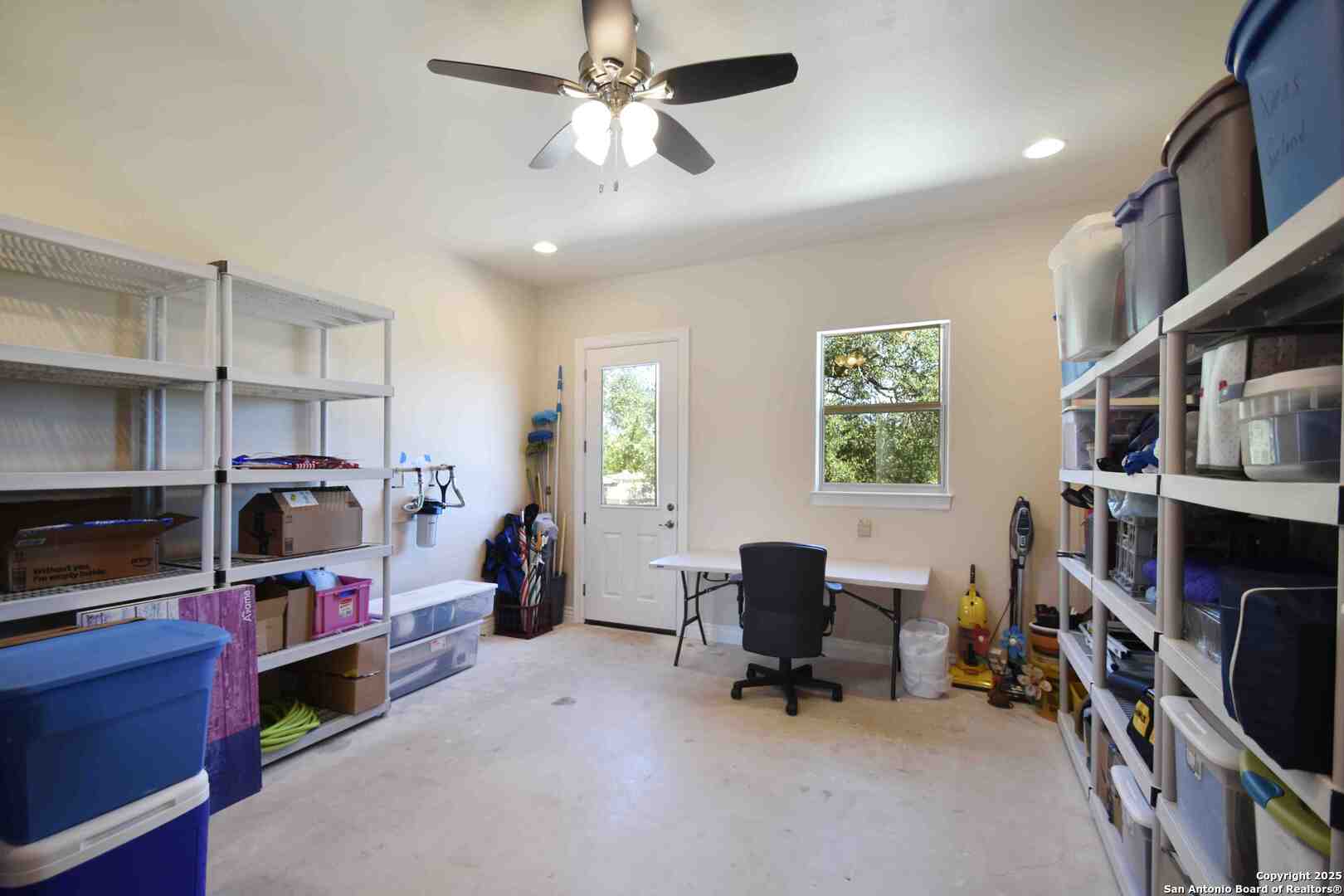 8 Braeburn Court Bulverde, TX 78163 - Photo 48 of 64 a view of a workspace with furniture and a window