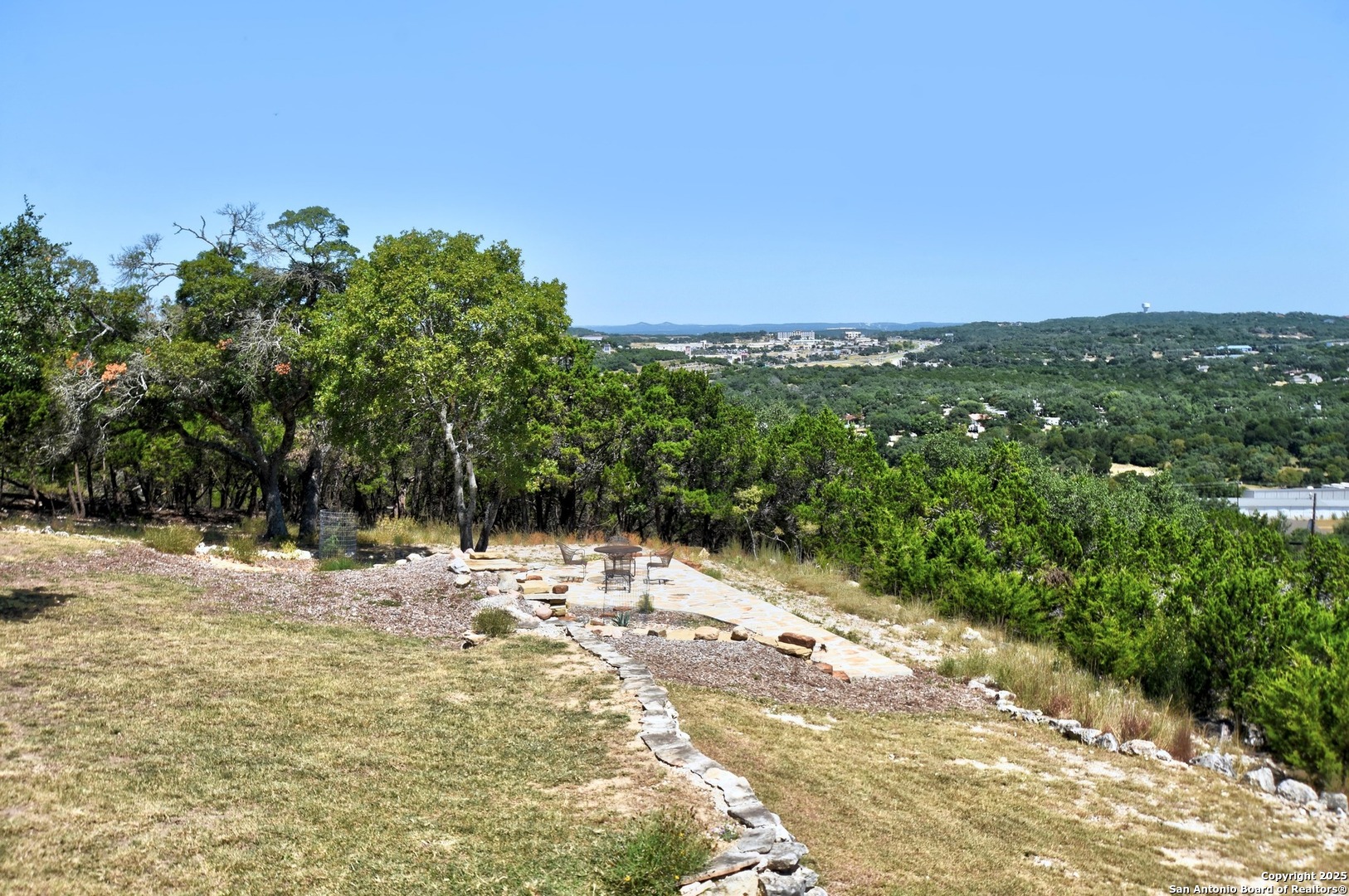 8 Braeburn Court Bulverde, TX 78163 - Photo 55 of 64 a view of a yard with a tree