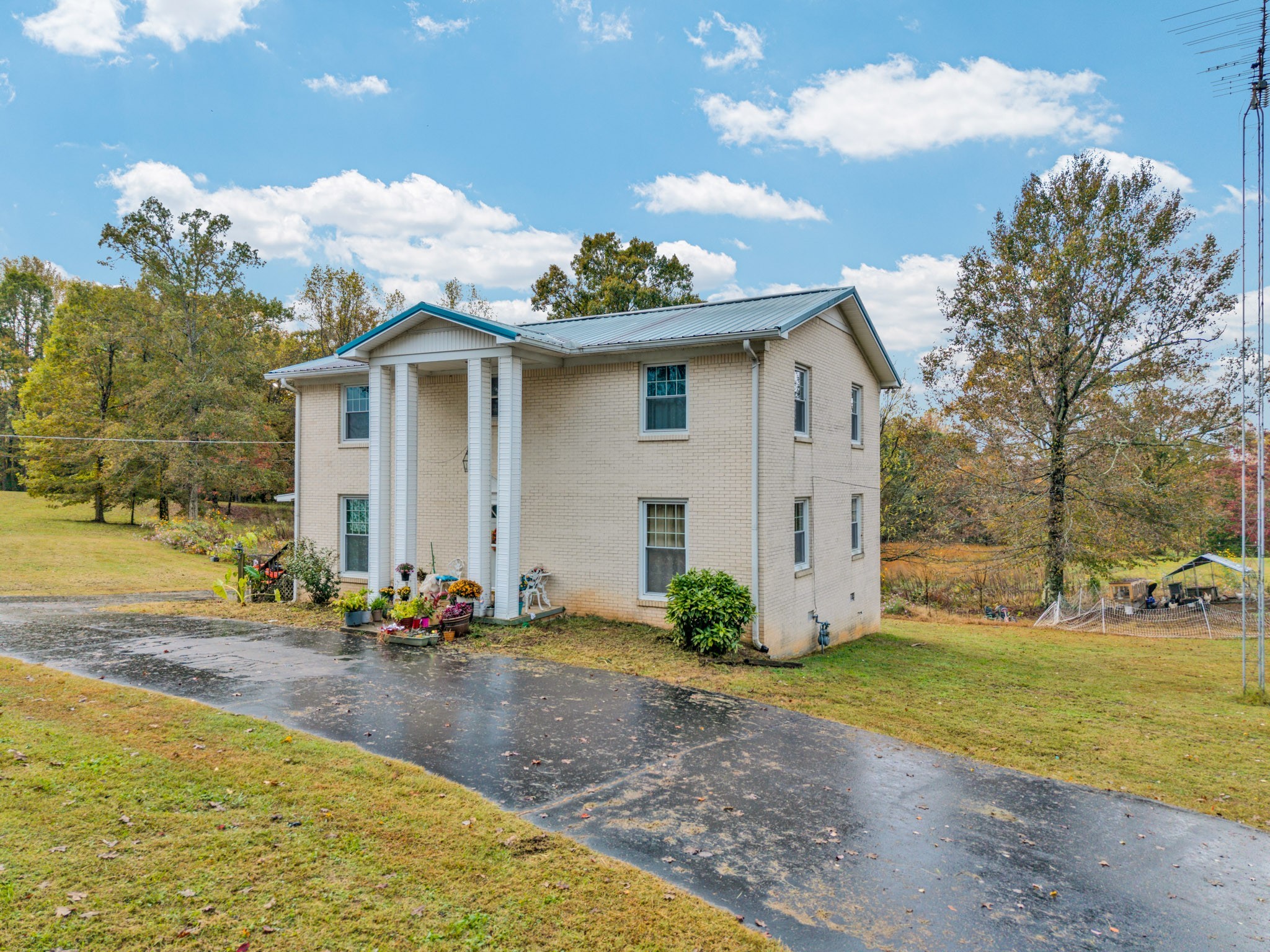 5881 Burgess Falls Road Sparta, TN 38583 - Photo 7 of 29 a view of a white house with a yard