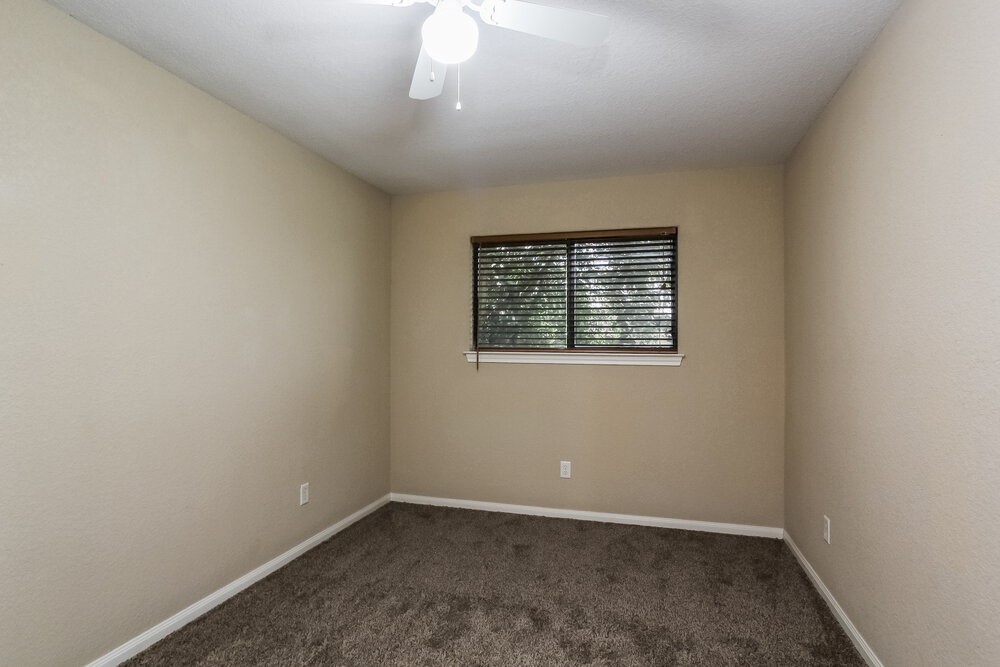131 Golfview Court Conroe, TX 77356 - Photo 13 of 16 an empty room with a window
