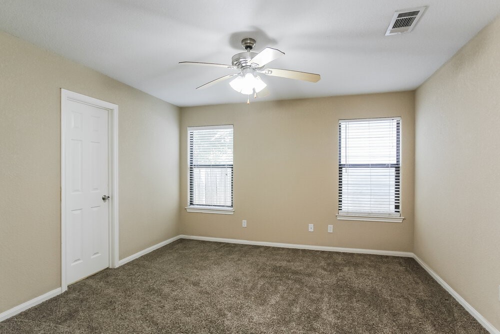 131 Golfview Court Conroe, TX 77356 - Photo 8 of 16 a view of an empty room with a window