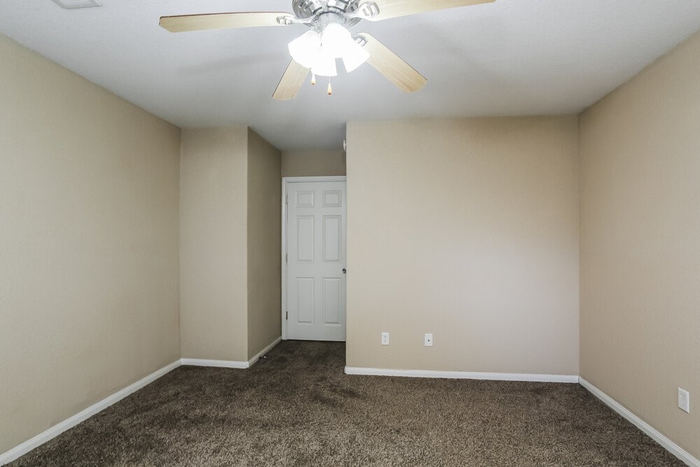 131 Golfview Court Conroe, TX 77356 - Photo 9 of 16 a view of an empty room and chandelier fan