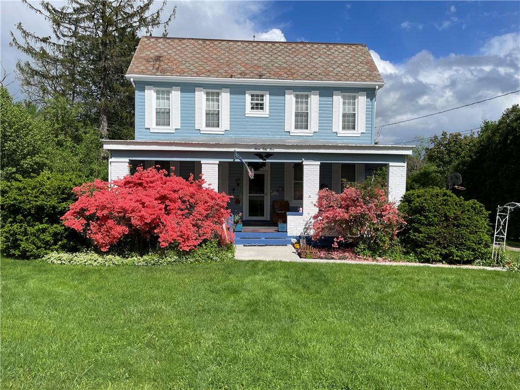 355 Old Plank Road Butler, PA 16002 - Photo 1 of 36 a front view of a house with a garden and plants