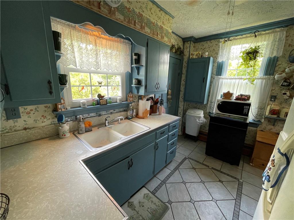 355 Old Plank Road Butler, PA 16002 - Photo 13 of 36 a bathroom with a sink a mirror and a bathtub