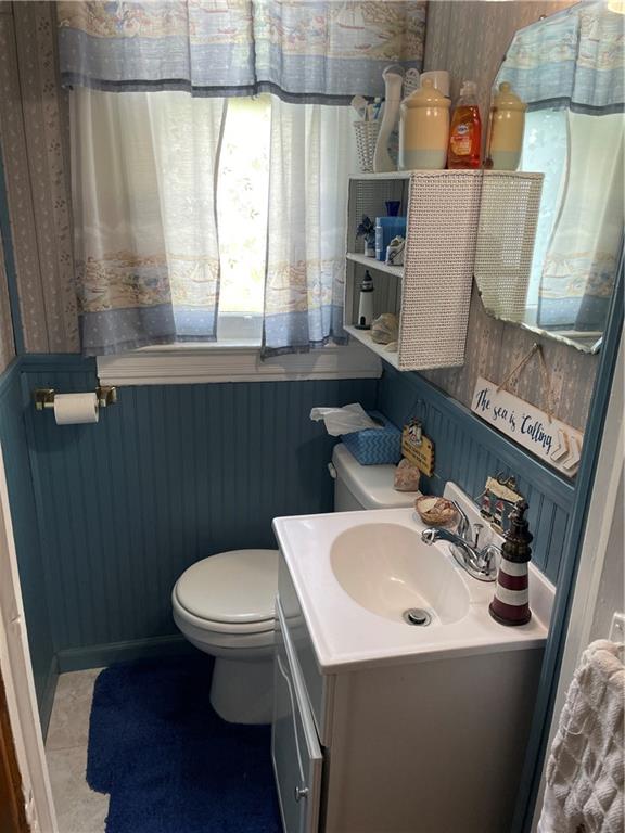 355 Old Plank Road Butler, PA 16002 - Photo 14 of 36 a bathroom with a sink a toilet and a mirror