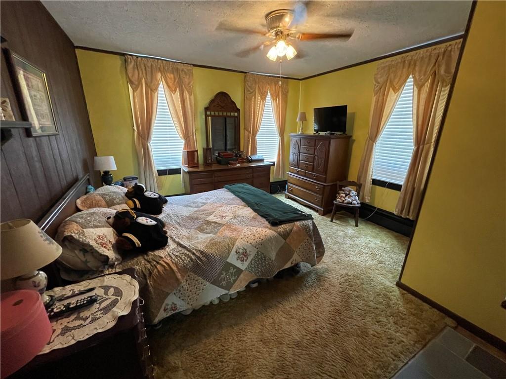 355 Old Plank Road Butler, PA 16002 - Photo 17 of 36 a bed room with a bed and a television