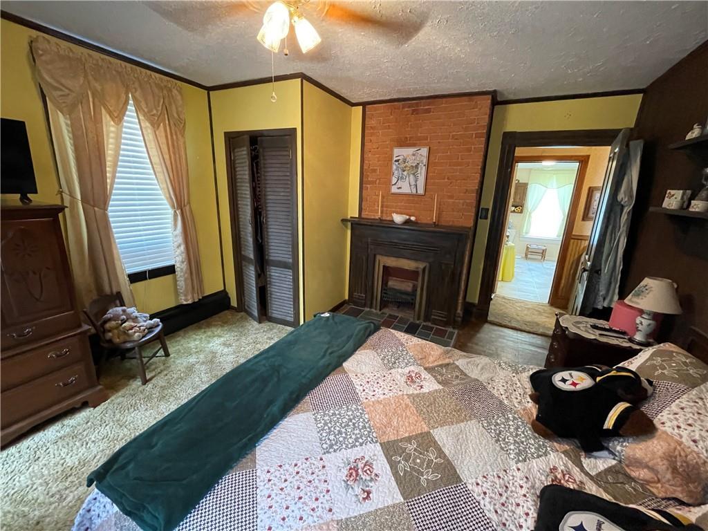 355 Old Plank Road Butler, PA 16002 - Photo 18 of 36 a bedroom with a bed and a mirror on dresser