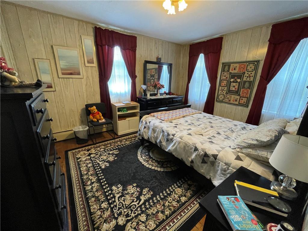 355 Old Plank Road Butler, PA 16002 - Photo 20 of 36 a bedroom with a bed and wooden floor