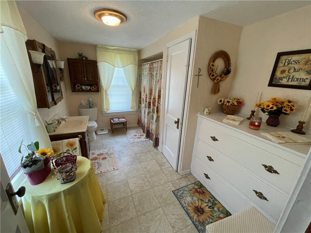 355 Old Plank Road Butler, PA 16002 - Photo 22 of 36 a living room with furniture and a flat screen tv