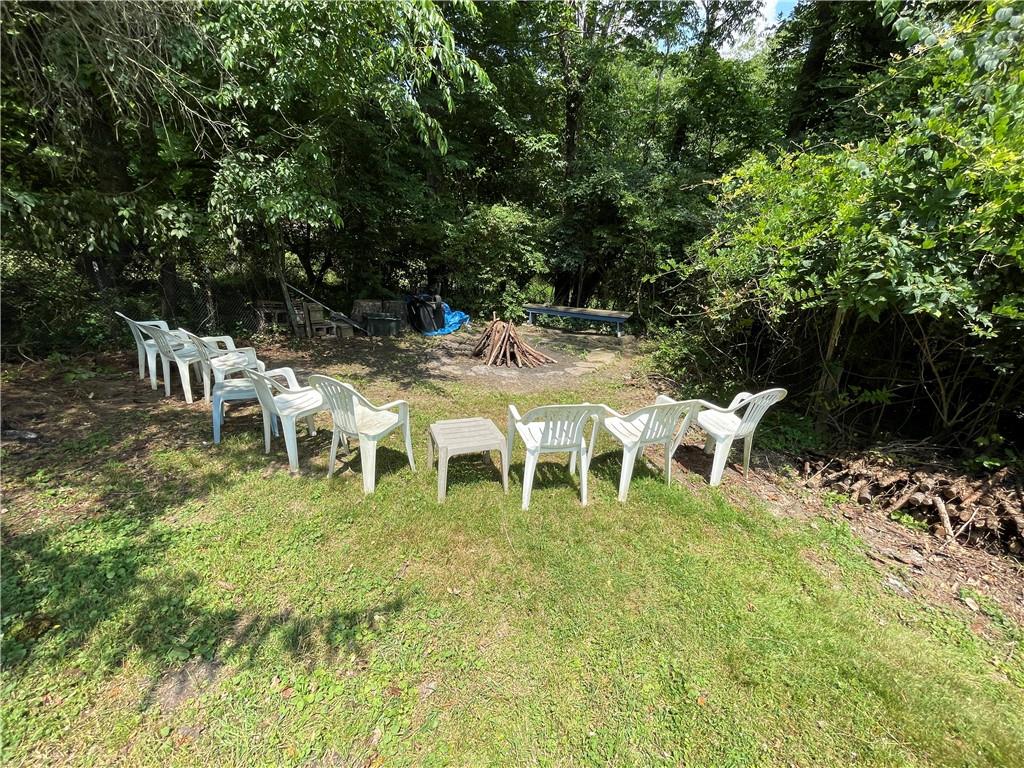 355 Old Plank Road Butler, PA 16002 - Photo 29 of 36 a group of lawn chairs sitting in a backyard