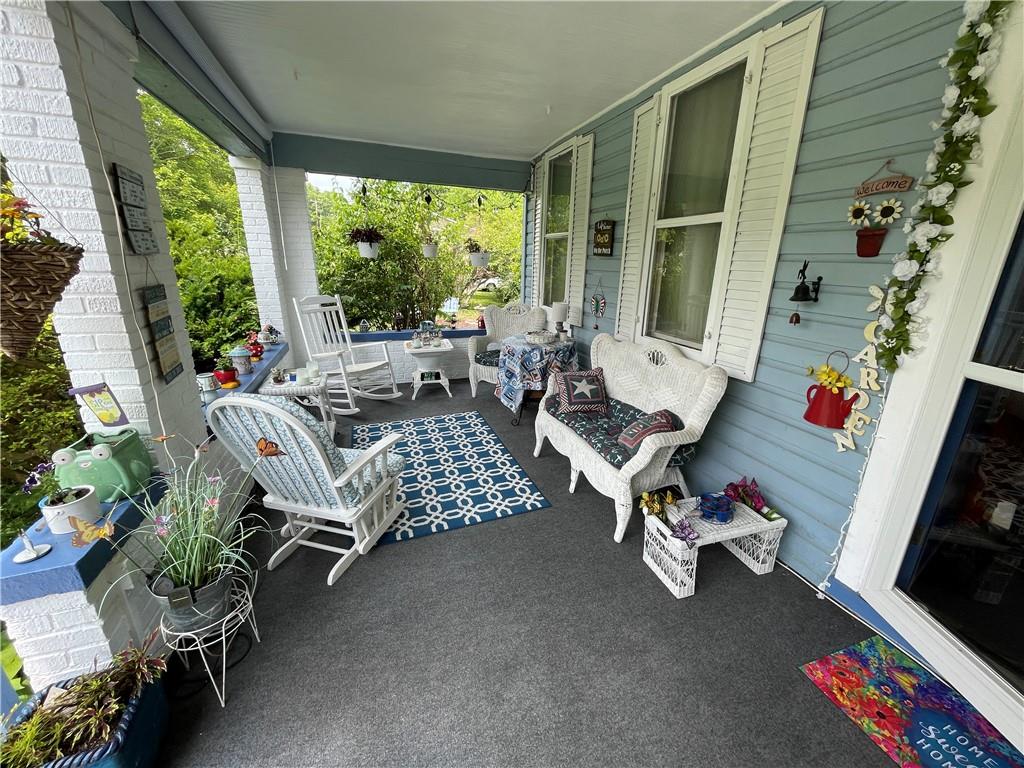 355 Old Plank Road Butler, PA 16002 - Photo 3 of 36 a living room with patio furniture and a floor to ceiling window