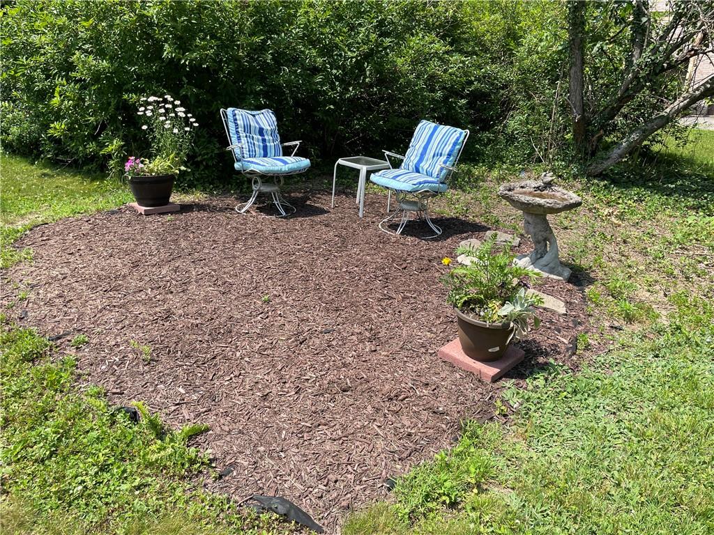 355 Old Plank Road Butler, PA 16002 - Photo 31 of 36 a view of a backyard with plants and a garden