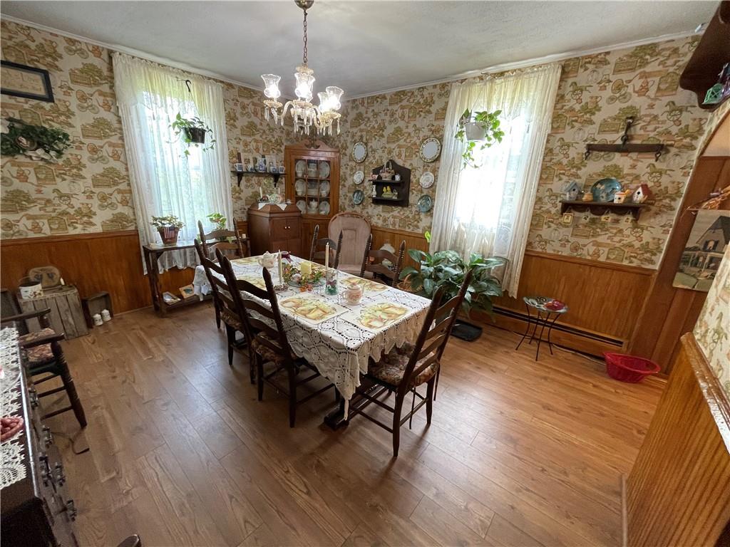 355 Old Plank Road Butler, PA 16002 - Photo 10 of 36 a living room with furniture and a chandelier