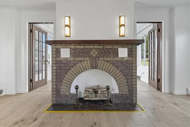 a close view of a fireplace with a table and chair